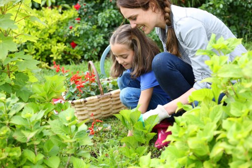 Accessible gardening workshop with seated attendees and a presenter showing tools