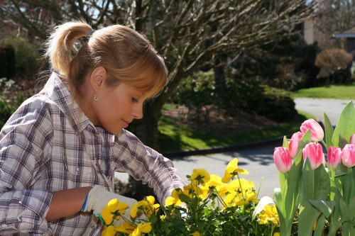 Volunteers sorting garden waste containers and recycling streams